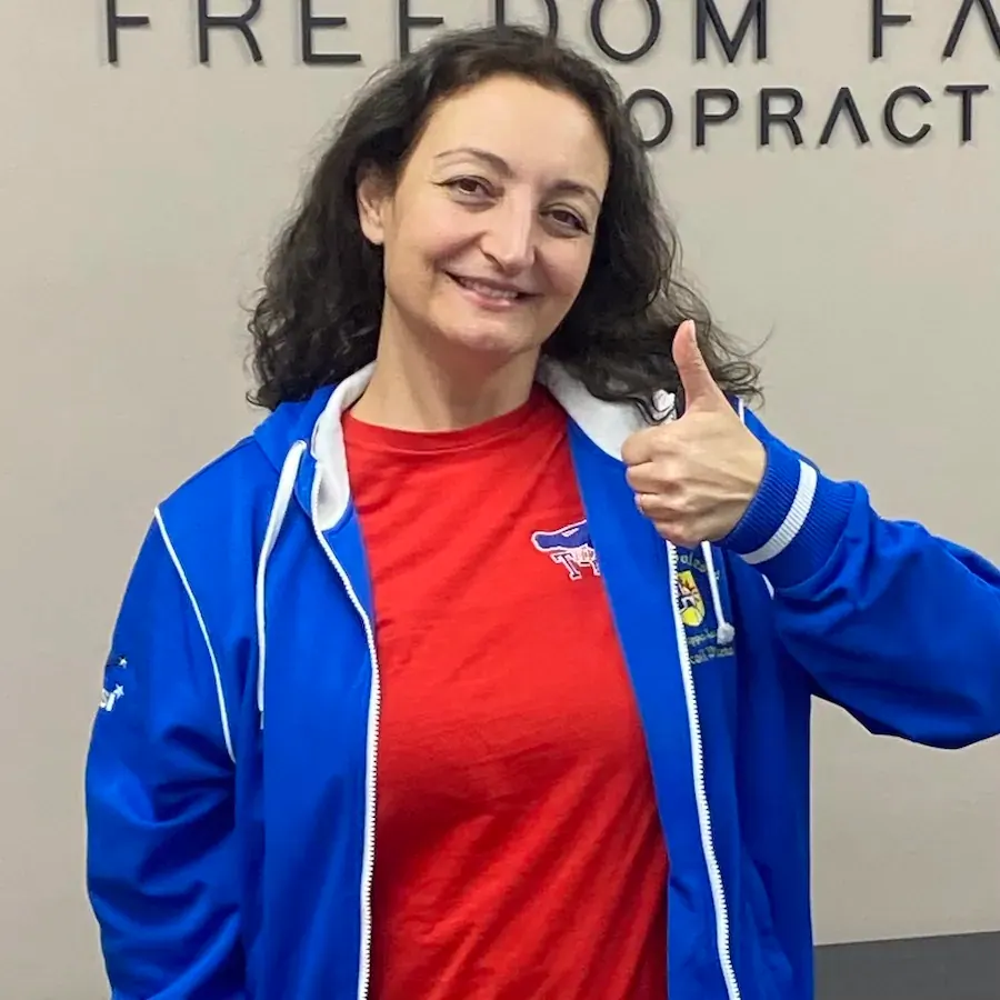 Happy patient at chiropractic office