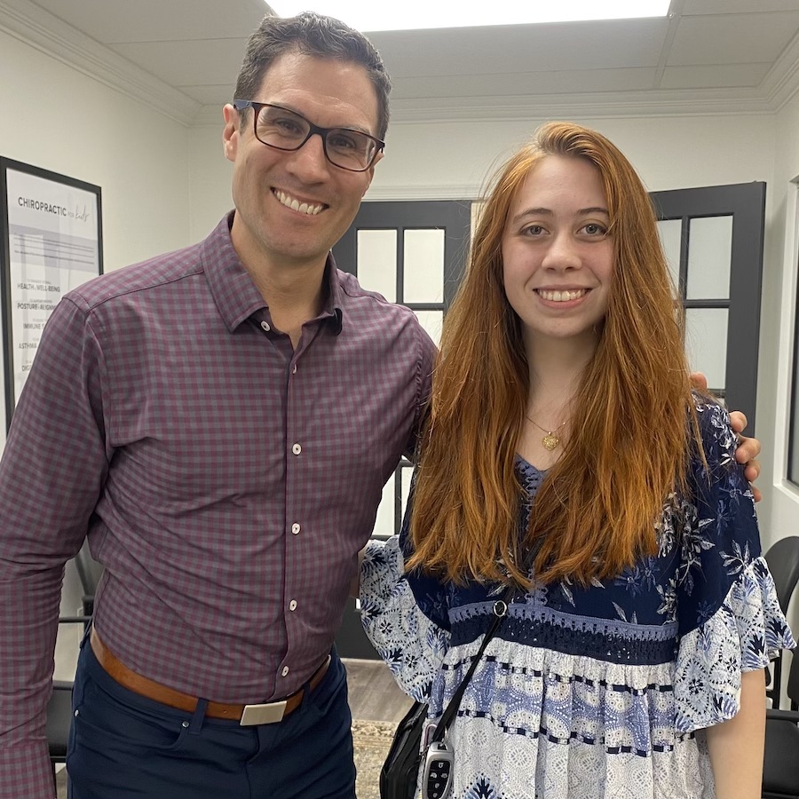 Patient posing with Dr. David Ridos