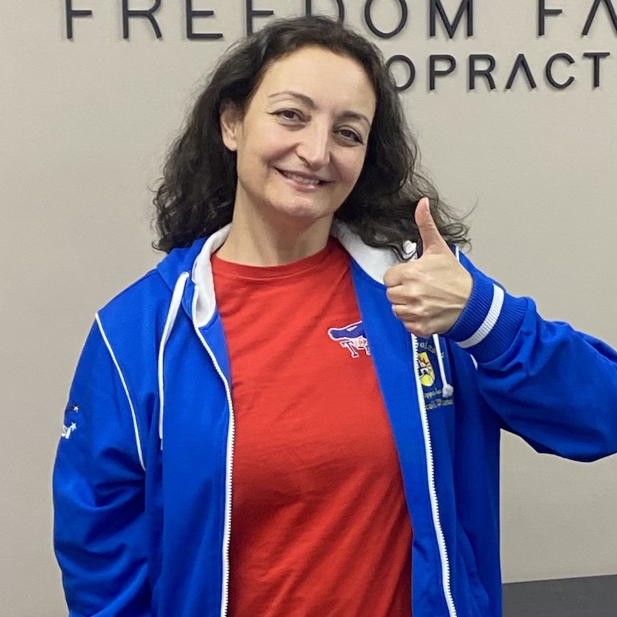Happy patient at chiropractic office